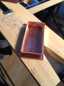 The makings of a copper bezel for a clay and resin insert.