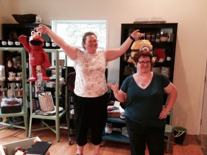 Jenn (with Kim, right) holds the Elmo and Minion pinatas, moments before their untimely end!